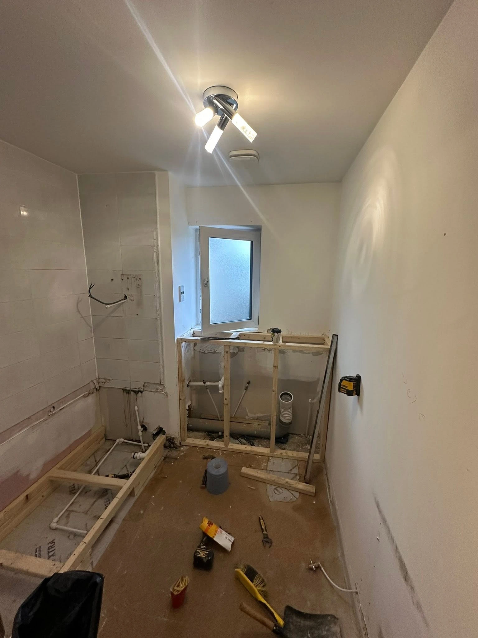 The same bathroom stripped back before the new installation